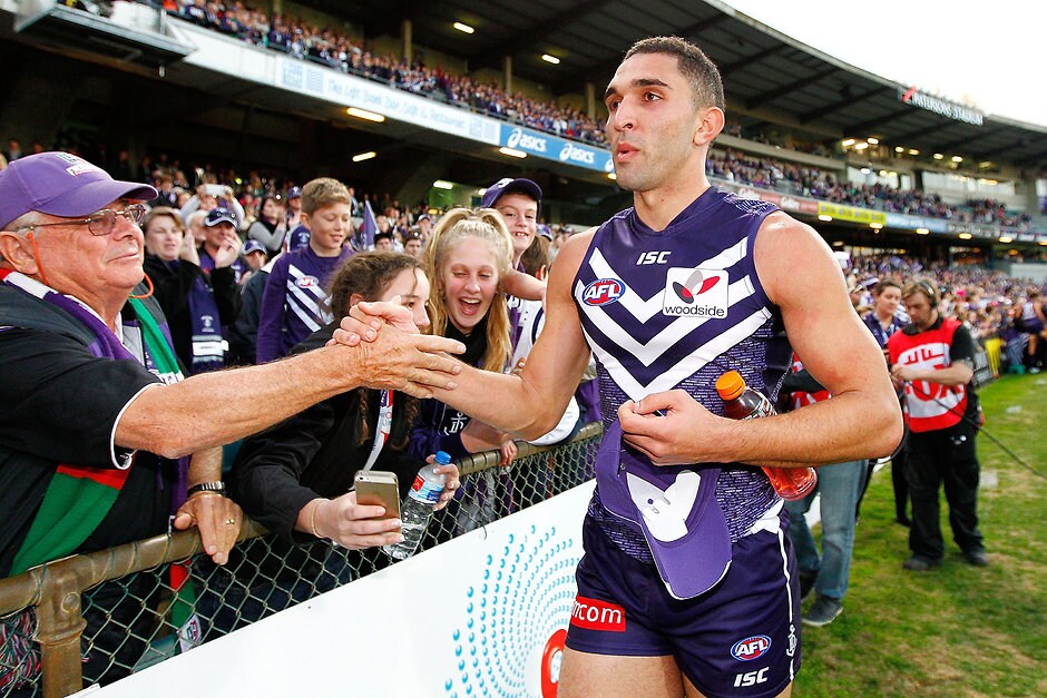 AFL 2014 Rd 17 - Fremantle v GWS Giants Anthony Morabito of the Dockers celebrates with supporters after the 2014 AFL Round 17 match between the Fremantle Dockers and the GWS Giants at Patersons Stadium, Perth on July 13, 2014. (Photo: Will Russell/AFL Media)